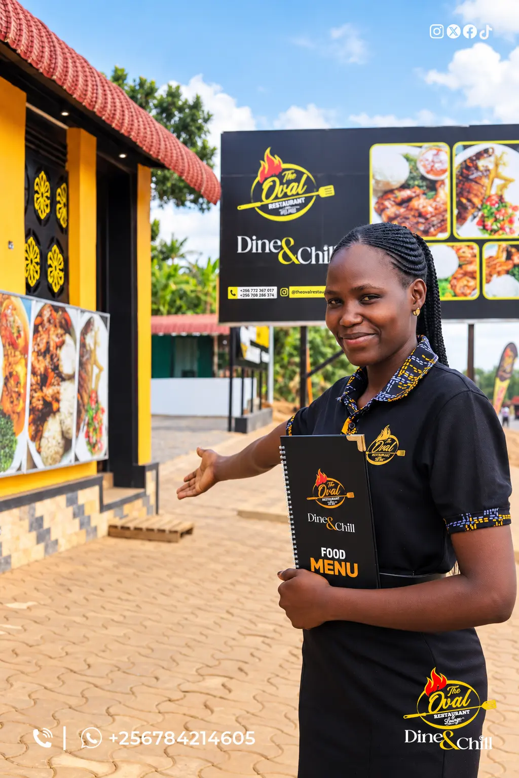 Oval team member welcoming guests at the restaurant entrance, holding the food menu